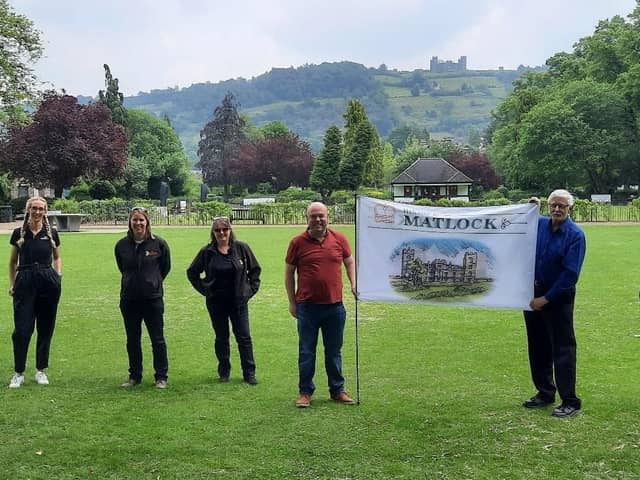 Matlock business owners and councillors proudly display the new flag.