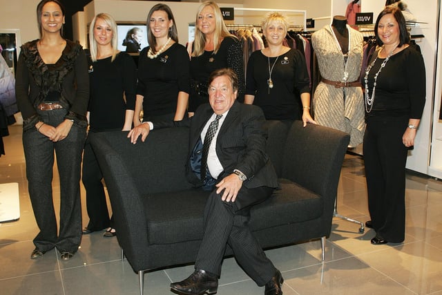 George Davis with some of the staff at his new G IV store in 2010