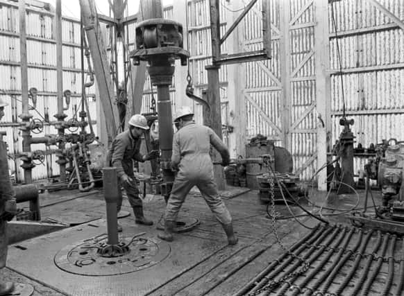 Men working on the drill on the Staflo oil rig in the North Sea, March 1971.