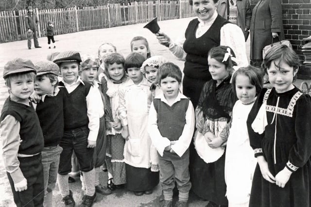 Retro Derbyshire Photo. Mrs Knight rings the bell at Heanor Howitt school, 1985.