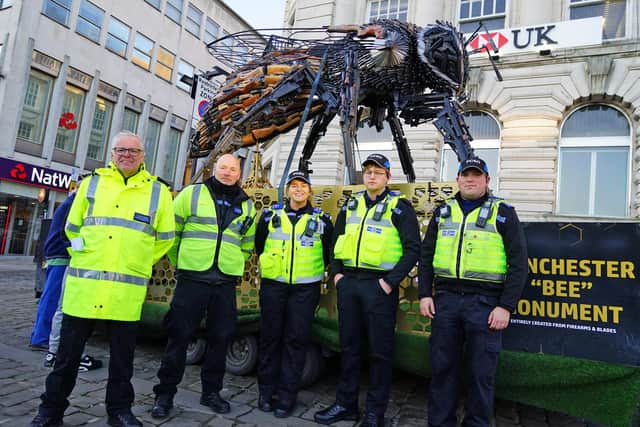 Local PCSO's and Derbyshire vehicle examiners with the bee monument in Chesterfield town centre.