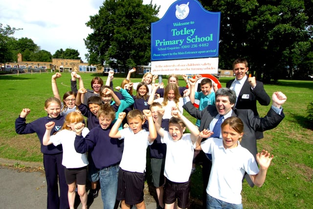 Staff and students were celebrating the improvement in their  performance rating in 2008. Seen cheering with the children are,  Head Angela Lant, Deputy Head Chris Stewart, and Councillor  Andy Sangar.