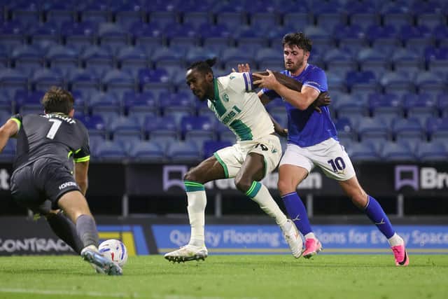 Lee Bonis pressures Gillingham's Omar Beckles
