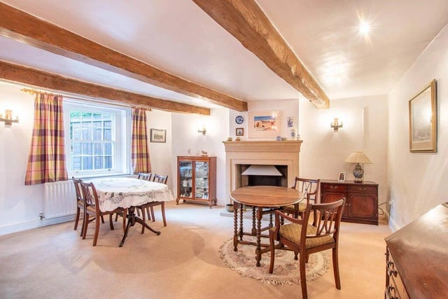 Accessed off the inner hallway is a spacious double aspect formal dining room with beams to the ceiling, a stone built open fire and separate access to the side of the property.