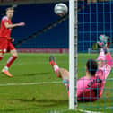 Chesterfield goalkeeper Kyle Letheren makes a crucial save during the penalty shootout win against Brackley Town.
