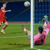 Chesterfield goalkeeper Kyle Letheren makes a crucial save during the penalty shootout win against Brackley Town.