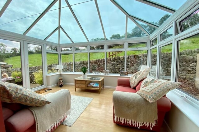 The conservatory is an ideal spot to sit and enjoy the garden, patio and surrounding fields.