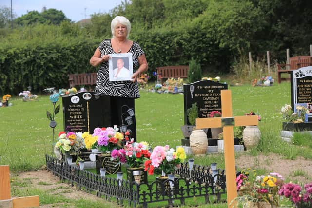 Jean White has won a battle to keep items on her late husband's grave at Eckington Cemetery.