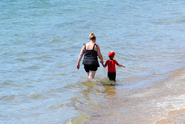 Going for a dip at the seafront in Southsea on the hottest day of the year so far. Picture: Sarah Standing (250620-4960)