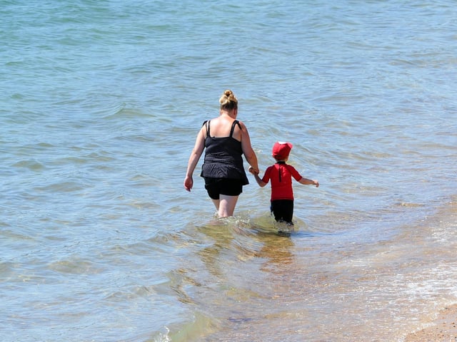Going for a dip at the seafront in Southsea on the hottest day of the year so far. Picture: Sarah Standing (250620-4960)