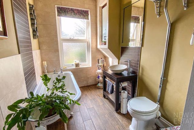 The traditional suite includes a freestanding roll top bath, separate shower cubicle, hand basin and wc.