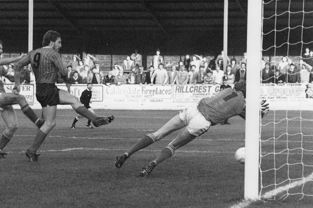 Bob Newton crashes the ball home after Halifax keeper Paddy Roche saved his penalty, in Town's 3-1 win over the West Yorkshire side.