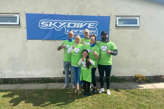 Chris and Kaela holt pictured with their family before the charity skydive