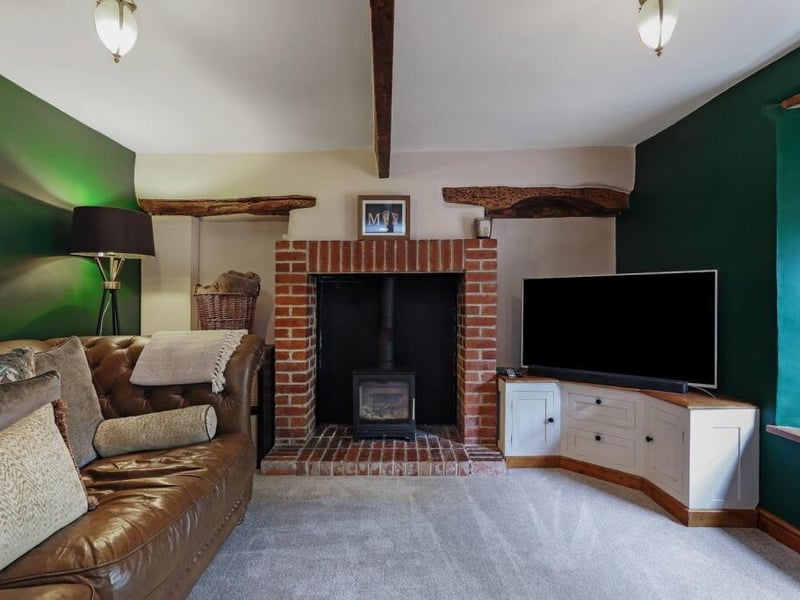 The lounge has a cosy log burner.