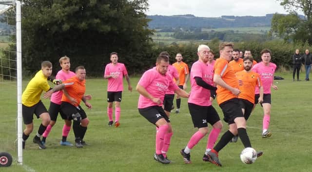 Action from Pilsley Community (tangerine) v New Whittington Newbold in HKL ONE. Photos by Martin Roberts.