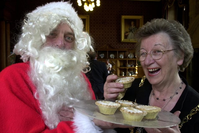 The Lord Mayor of Sheffield Councillor Mrs Marjorie Barker gets an early visit from Santa at the Town hall where he handed over donations to the Mayor's Charity  and mince pies  in 2002