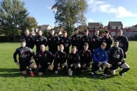 Grassmoor FC show off their new kit following their donation from Harron Homes.