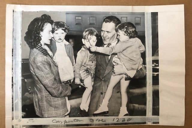 Cutting from Time magazine showing Norah Carpenter and her three children being greeted in New York by William Thompson.