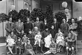 Victor Cavendish, 9th Duke of Devonshire, with his children and grandchildren at Chatsworth, Christmas 1925. Andrew Cavendish, the 11th Duke, sitting at his mother's feet on the far right.  (Photo by NEMPR Picture the Past/Heritage Images/Getty Images)
