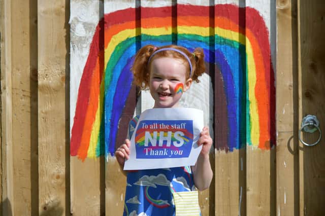 Lois Friel (6) with her message from us all to NHS staff
