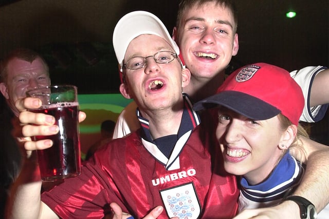 Fans celebrate during the England World Cup campaign against Nigeria match, 2002. L-R, Chris Livingstone, Chris Doyle  and Kelly Anderson