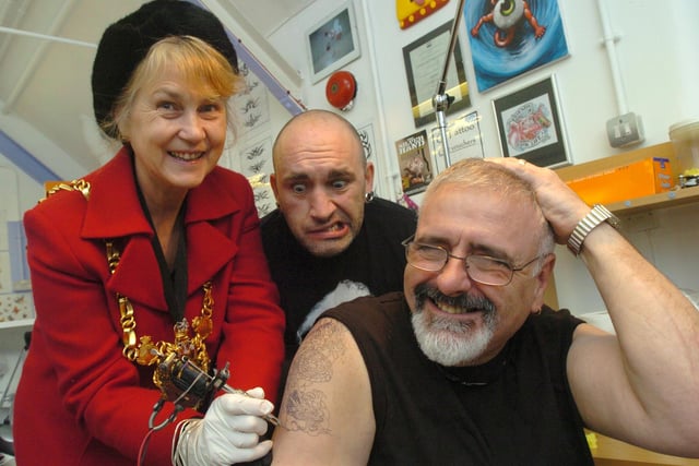 Pictured at Qtattoo, at the craft workshops, Orchard Square, Sheffield,  in 2006 where former Lord Mayor Coun Tony Damms was having a tattoo done to raise money for the Lord Mayor's Charity. Seen is Lord Mayor Coun Jackie Drayton as she started off the tattoo of a Japanese  style Dragon, watched by tattoo artist Quoz.