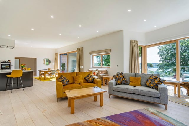 The light and airy open plan design gives a flow-through feel to the living space, taking you from the kitchen to the dining room and onto the sitting areas with doors opening onto the terrace.