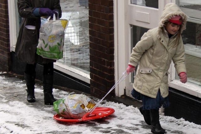 Pulling the shopping home after snow fell in December 2010