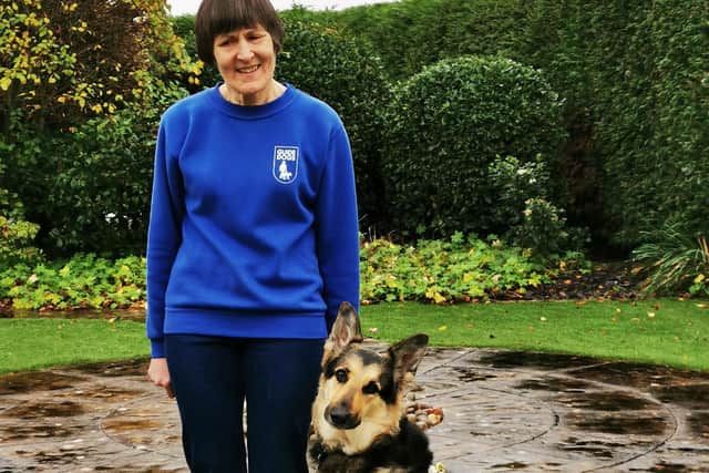 Irene Cooper with her guide dog Demi.