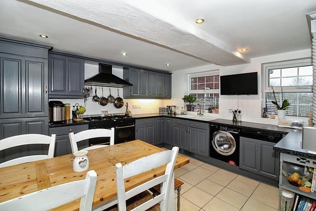 The hub of the home, this lovely kitchen/diner is fitted with integrated appliances and a stove.