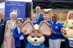 The Mayor of Chesterfield, coun Glenys Falconer, her consort Keith Falconer, Walton Peak Flying High Academy headteacher Mark Parkinson, pupils from the school, and Lynn Jones, Community Fundraiser at Ashgate Hospicecare, pictured with Chesterfield FC mascot, Chester the Fieldmouse
