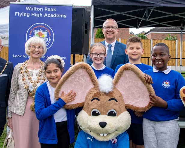 The Mayor of Chesterfield, coun Glenys Falconer, her consort Keith Falconer, Walton Peak Flying High Academy headteacher Mark Parkinson, pupils from the school, and Lynn Jones, Community Fundraiser at Ashgate Hospicecare, pictured with Chesterfield FC mascot, Chester the Fieldmouse