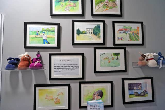 Illustrations from the book have been turned into a wall display at the home, alongside textile bunnies made by the residents in craft sessions.