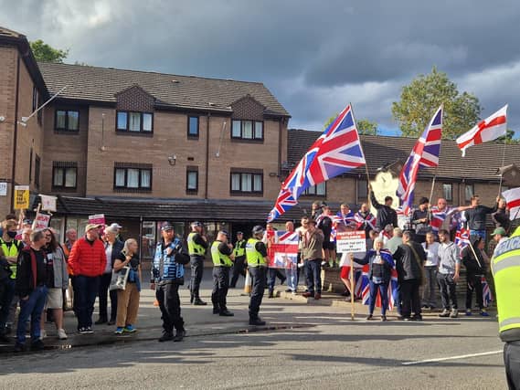 Hundreds of people have gathered in front Sandpiper Hotel in Chesterfield as anti-migration protest and counter protest were held.
