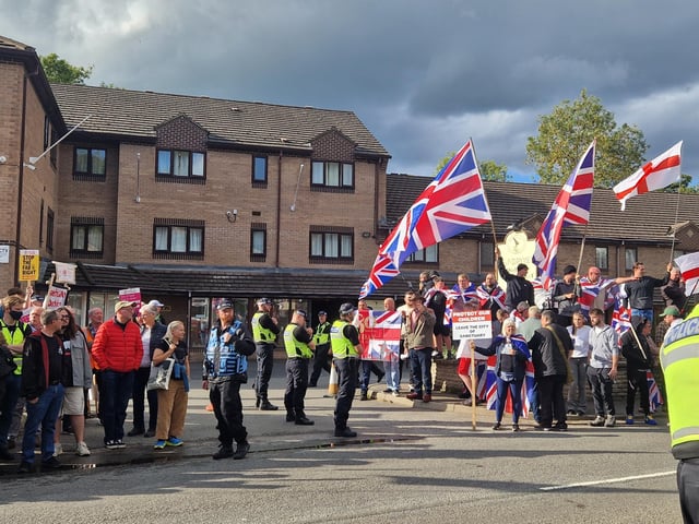 Hundreds of people have gathered in front Sandpiper Hotel in Chesterfield as anti-migration protest and counter protest were held.