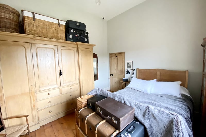 On the first floor are two double bedrooms, both with wooden floors. This room offers built-in storage.