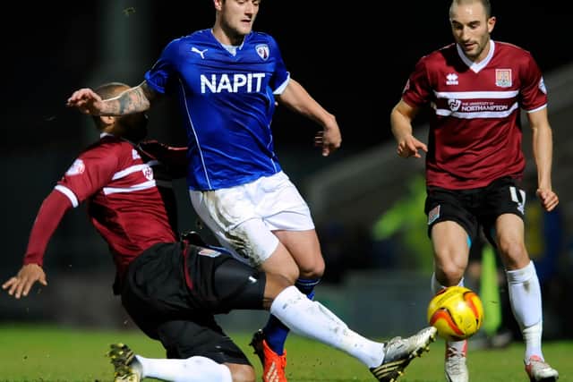 Cooper played for the Blues under manager Paul Cook.