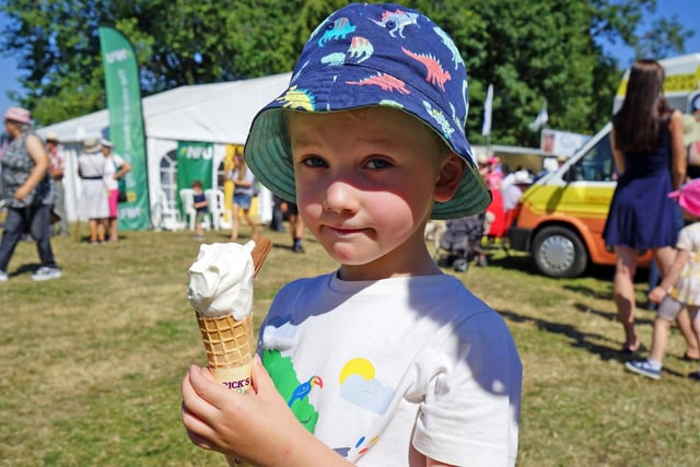George Aldred, 4, enjoys an ice cream at Ashover Show 2022.