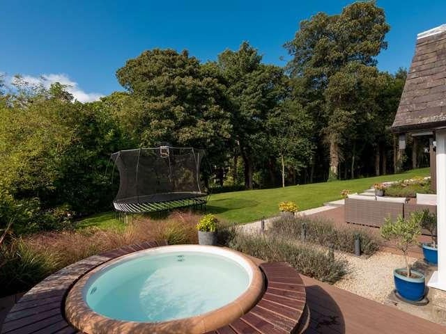 New owners can enjoy sunny weather from the built in hot tub.