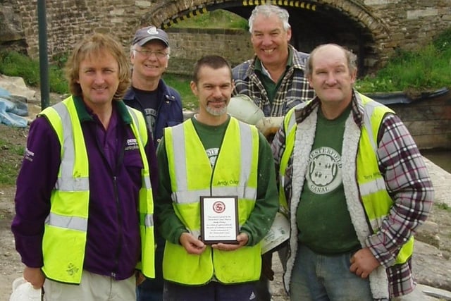 Andy Oxley (centre), honoured for  ten years' voluntary work on Chesterfield Canal in 2007,  with supervisor Mick Hodgetts on his right and assistant supervisor Terry Berridge on his left.