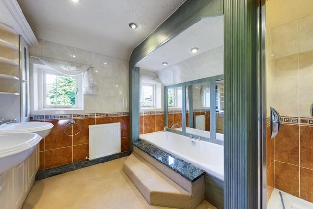 Step up for a soak in this luxurious bath or a quick wash in the separate shower cubicle.