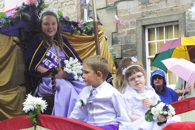 All eyes on the Winster Carnival queen and her attendants as they pass through the crowds at the Winster Wakes festival.