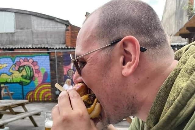 Pub customer Gavin Richards tries out the Doughnut Burger
