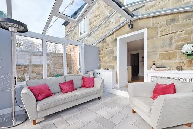 "Also from the dining room, a step descends into the bright and airy conservatory which has electric, under floor heating and has French doors which open into the South facing side garden,” says the brochure.