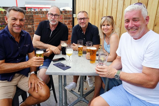 Friends gathered at the Junction bar to enjoy the warm weather and toast Craig's birthday!