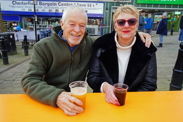 Jim Sarvent and Kate Sarvent enjoying a drink at the market.