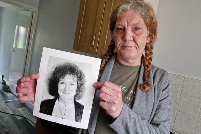 Mandy Shields, from Sheffield, pictured with a photo of sister Dawn, who was murdered in 1994