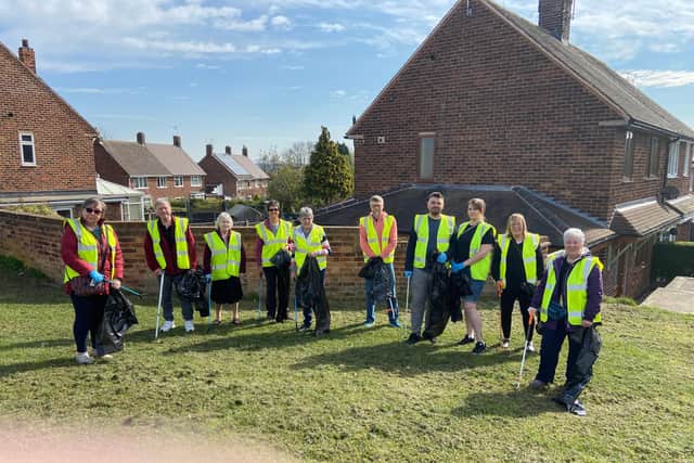 Members of the Inkersall community gather for their litter pick.