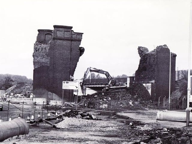 The demolition of the old Horns Bridge is captured in this photograph. Once part of a railway viaduct which straddled Derby Road, it was removed to make way for the new bypass.