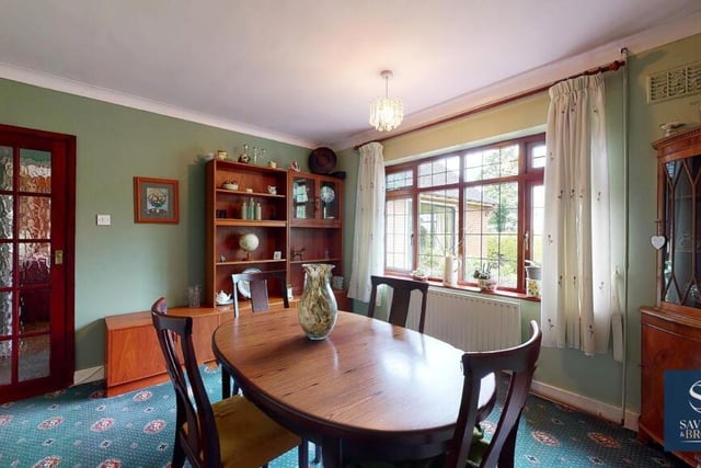 This room is currently being used as a delightful dining room, with fine views from the window of open fields. But it could also be converted into the bungalow's fourth bedroom if necessary.